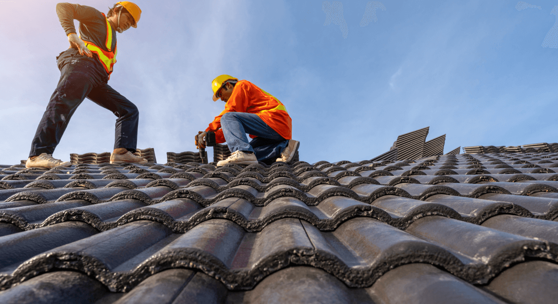 written by:, professional qualified roofer protective uniform wear use electric drill install concrete roof tiles new roof new modern building construction
